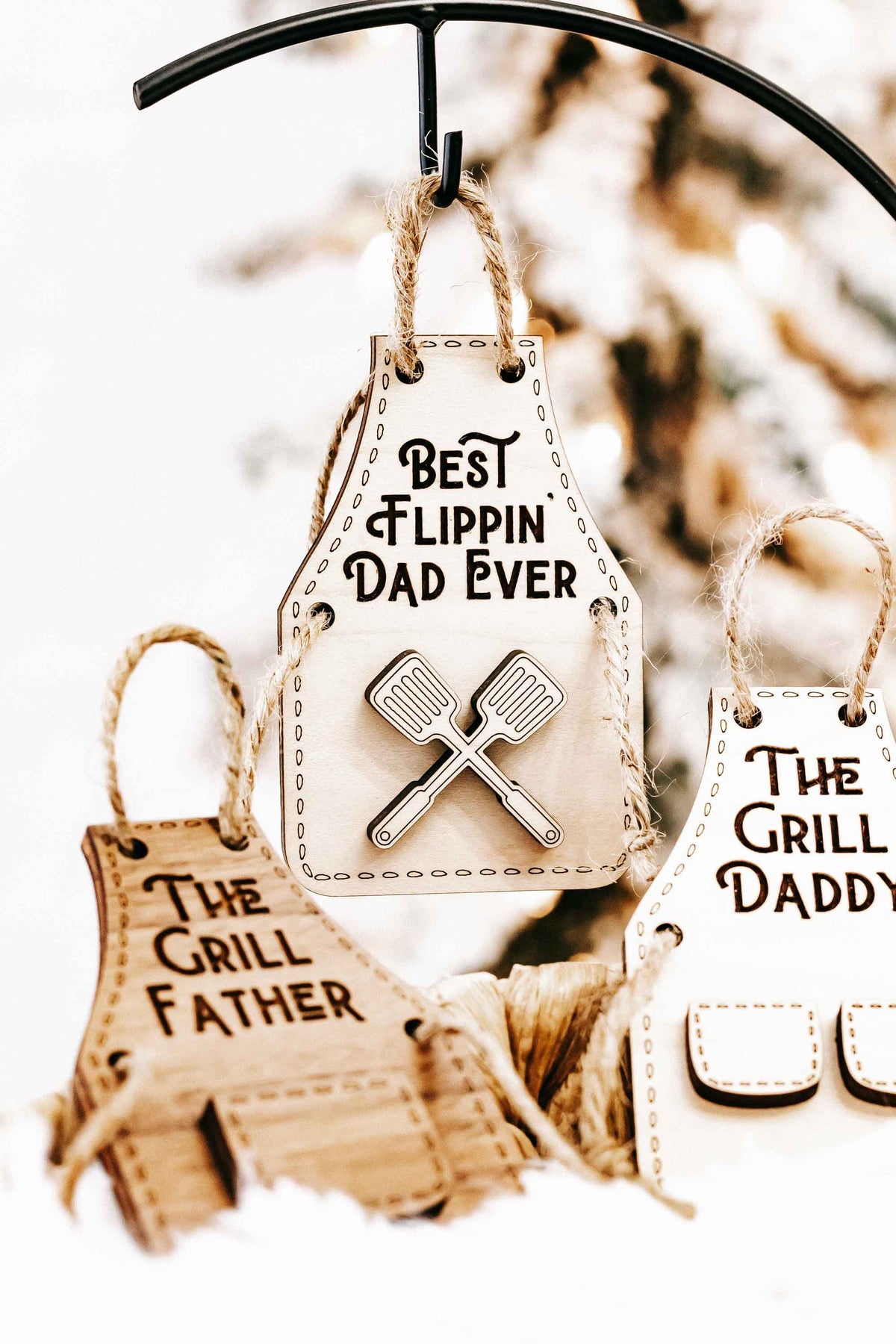 Wood ornaments: “Best Flippin’ Dad Ever” with crossed spatula design and “The Grill Father” behind.