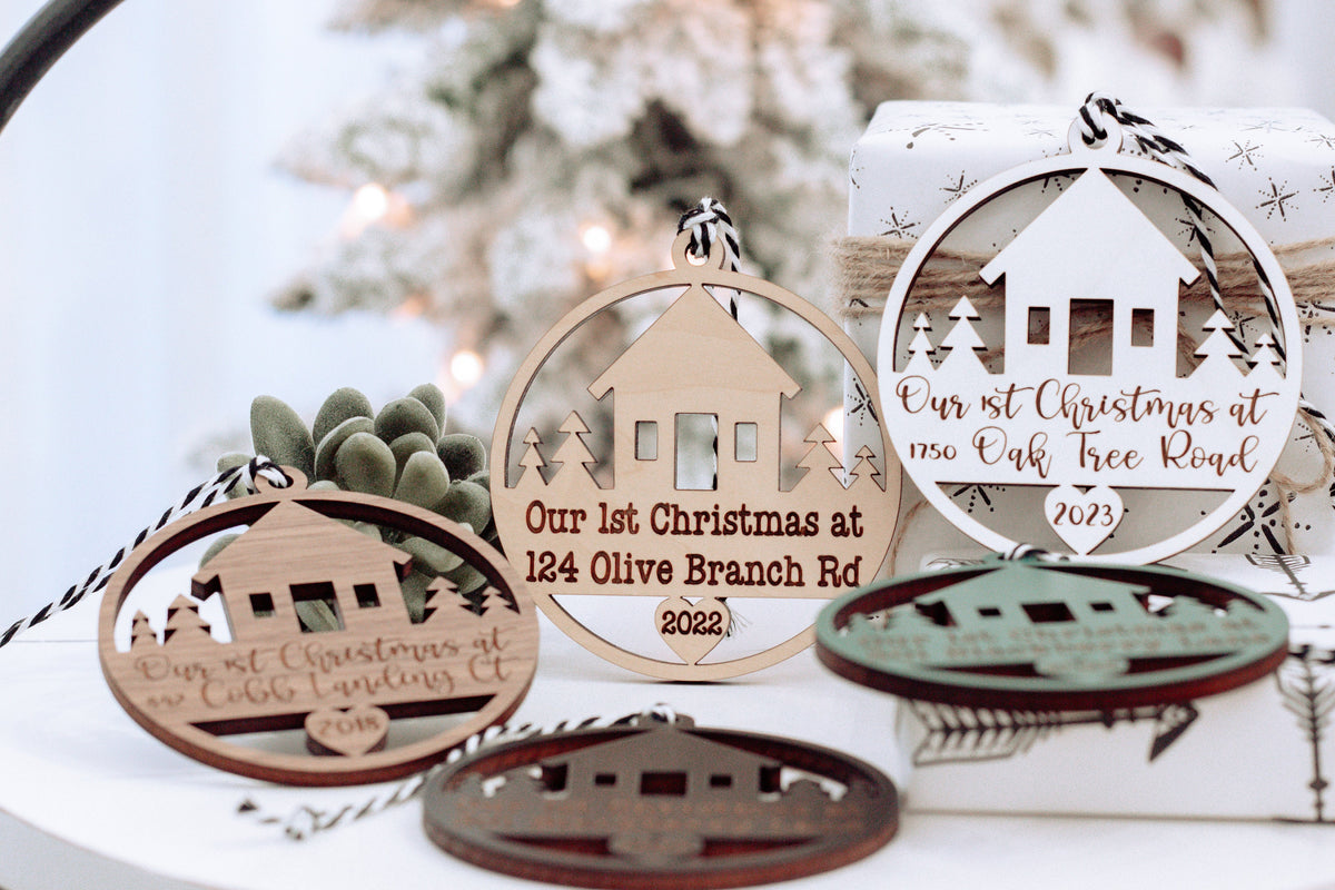 Set of round wooden Christmas keepsake ornaments with hanging loops and house cutouts