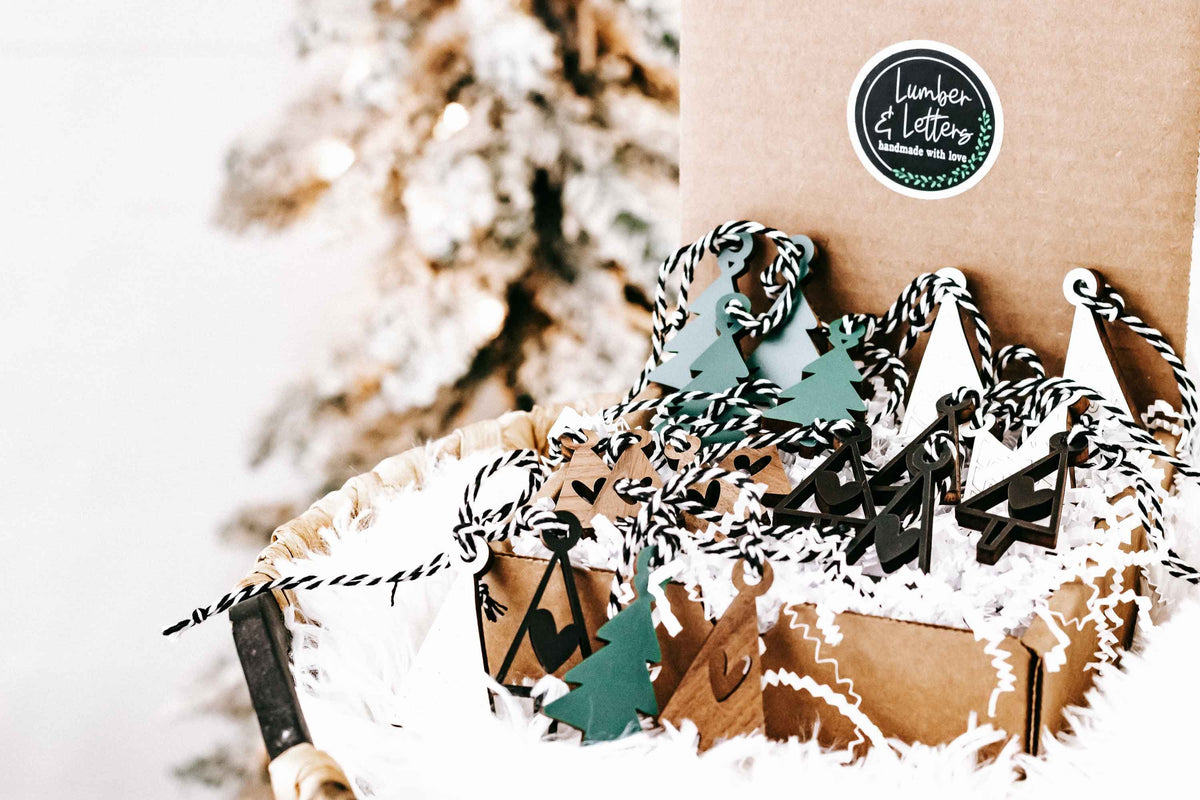 Mini wooden Christmas tree ornaments with hanging loops and mixed cutout designs