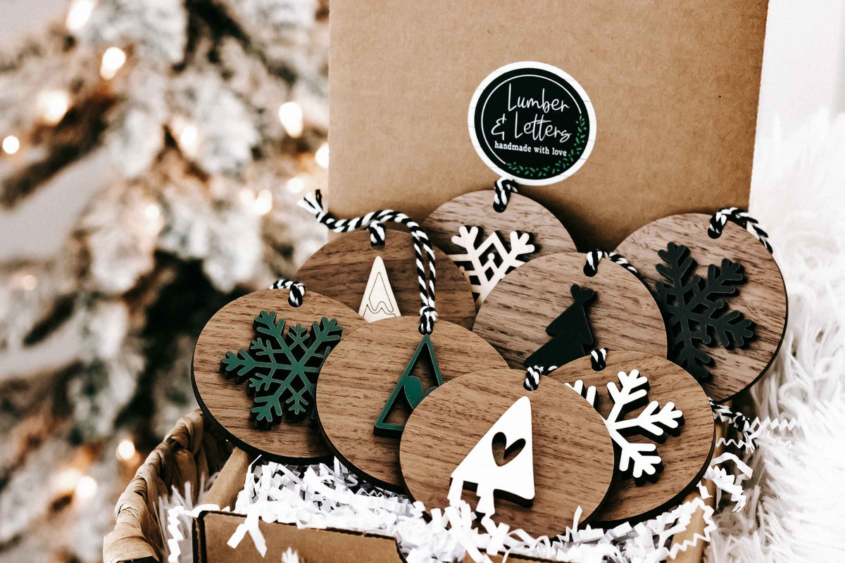 Set of 8 wooden Christmas ornaments in kraft box, featuring snowflakes, trees, and stars