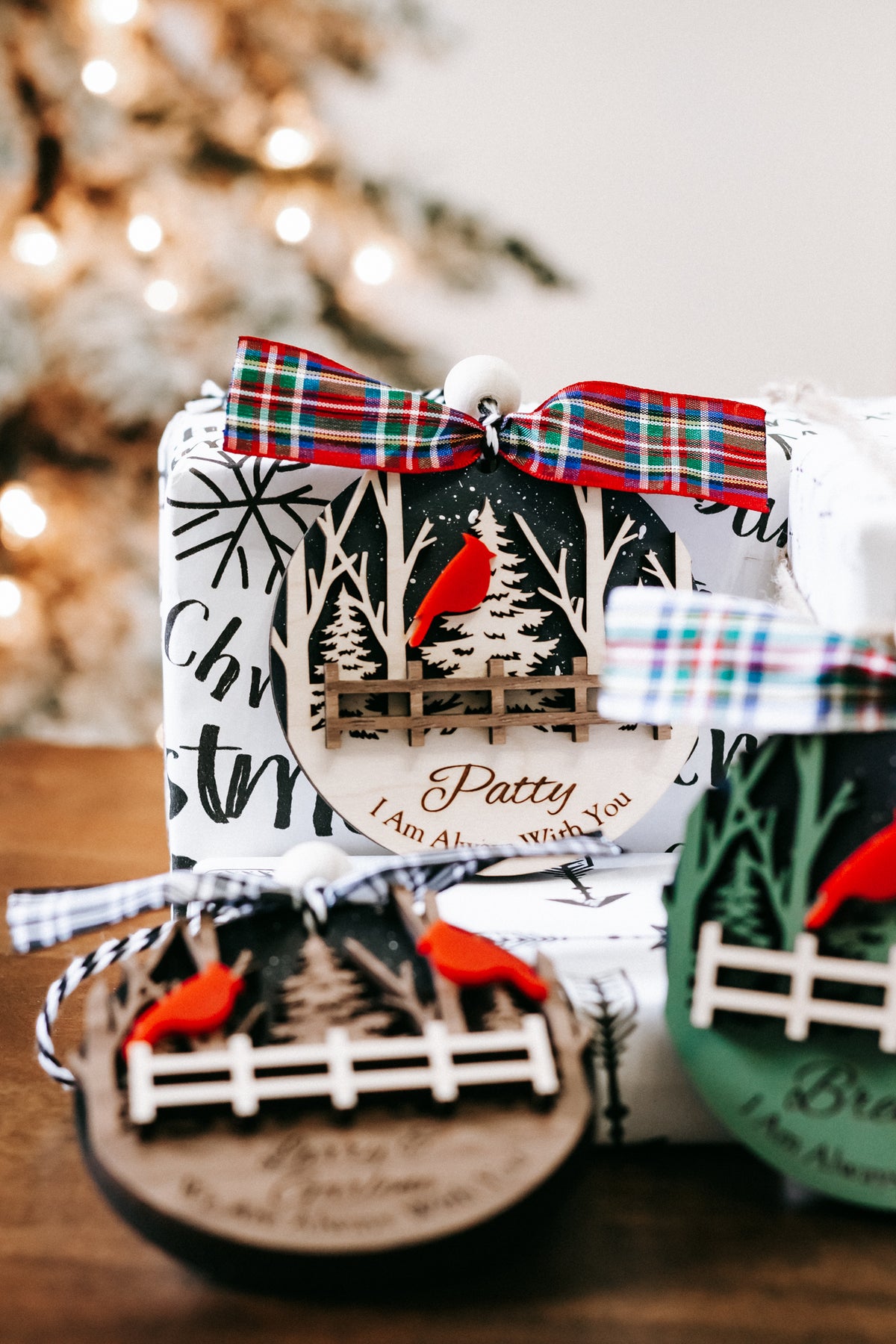 Personalized cardinal memorial ornament with plaid bow, red cardinals, forest scene and name text