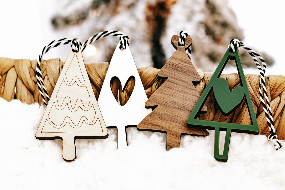 Assorted wooden Christmas ornaments: tree, heart, and triangle shapes with rope hangers