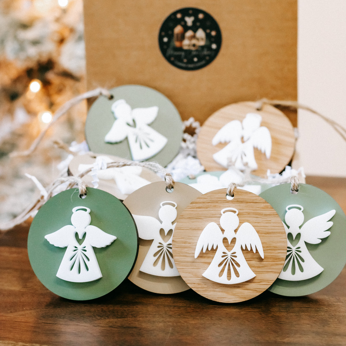 Layered angel Christmas ornaments on twine, green and wood round discs with hanging loops