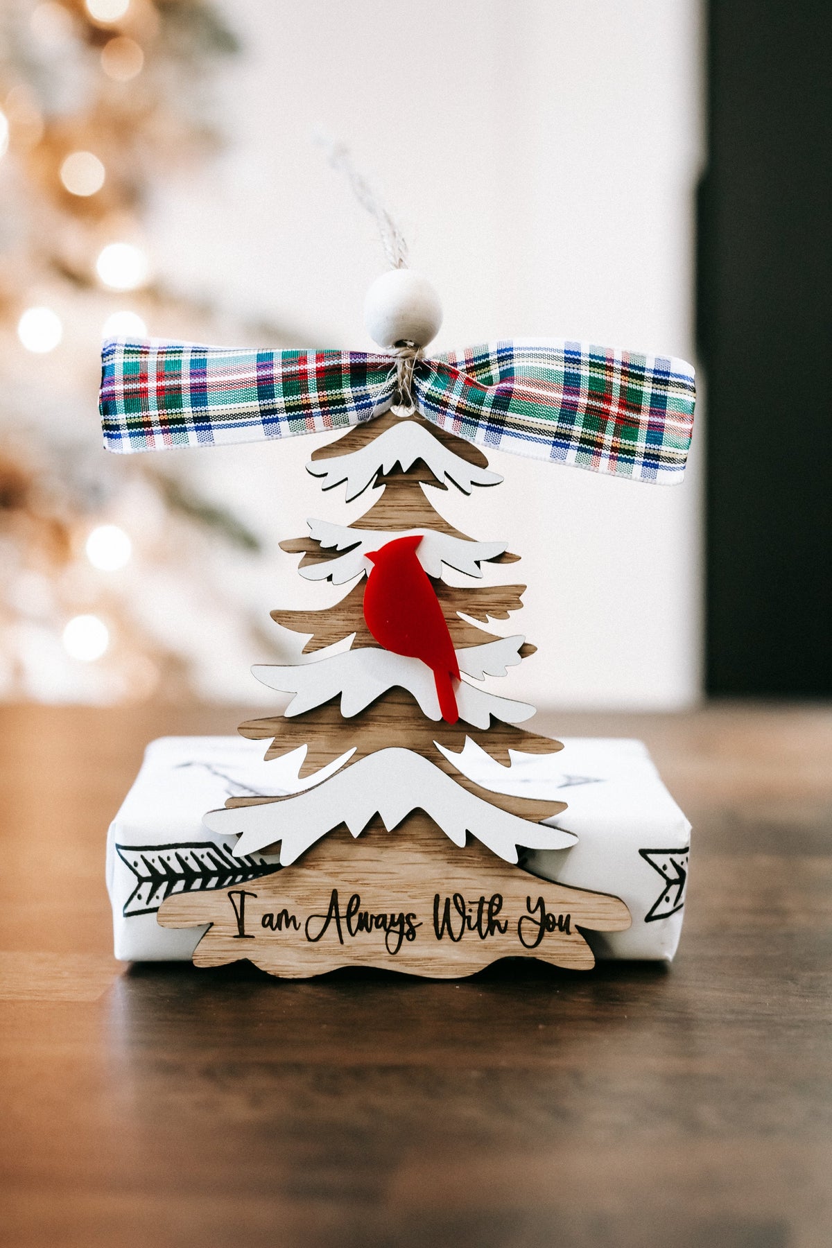 Cardinal memorial Christmas ornament with white tree cutouts, red cardinals, plaid bow