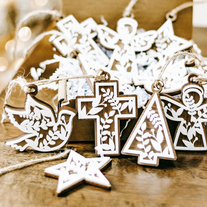 Set of 10 floral cutout ornaments with star, cross, and tree angel designs on twine