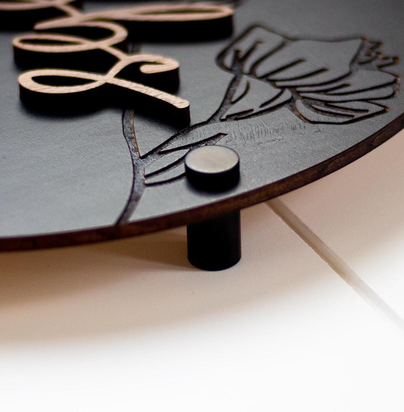 Round wood accessibility sign engraving with male and changing pictogram shapes