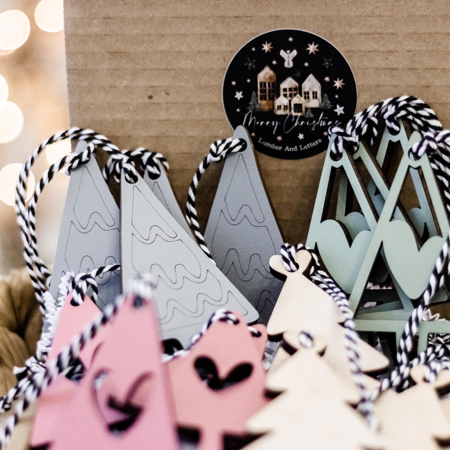 Boho Christmas ornament set with blush pink, sage, and white hanging trees and heart cutouts