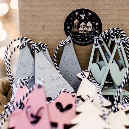 Boho Christmas ornament set with blush pink, sage, and white hanging trees and heart cutouts
