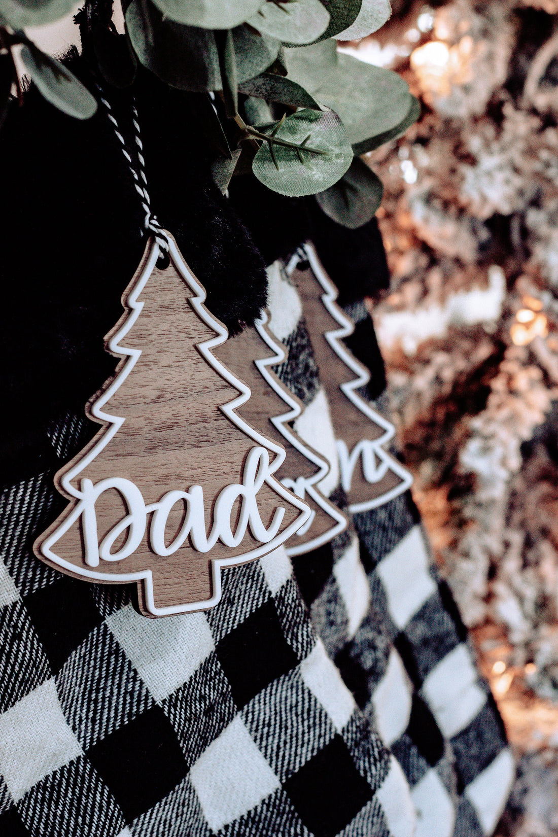 Personalized Christmas tree ornament tag on buffalo plaid stocking