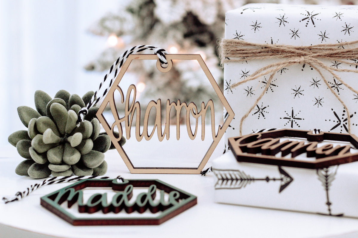 Wooden hex name ornament with cursive “Shamron” engraving, light wood, twine loop
