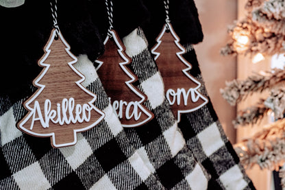 Personalized Christmas tree ornament tags with cutout border on buffalo plaid