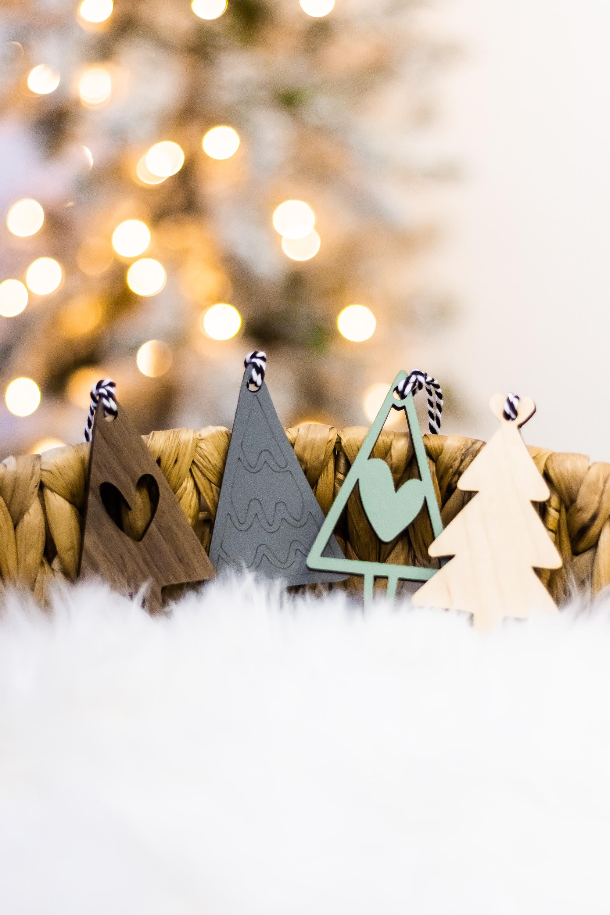 Set of 16 boho wood Christmas ornaments with tree cutouts and rope-style hanging cords