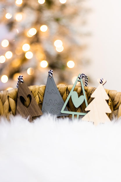 Set of 16 boho wood Christmas ornaments with tree cutouts and rope-style hanging cords