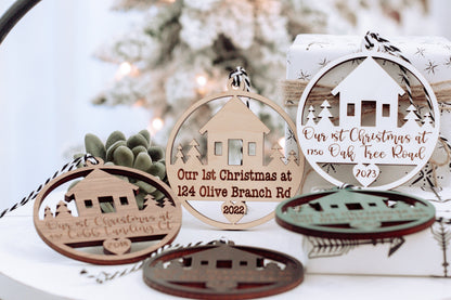 Set of round wooden Christmas keepsake ornaments with hanging loops and house cutouts
