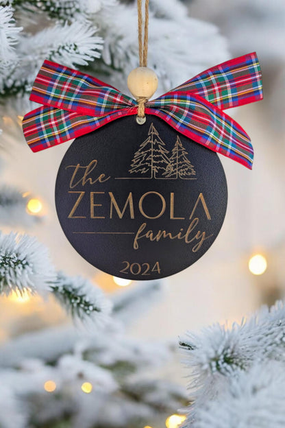 Family name Christmas ornament with red and blue plaid bow, “The ZEMOLA family 2024”