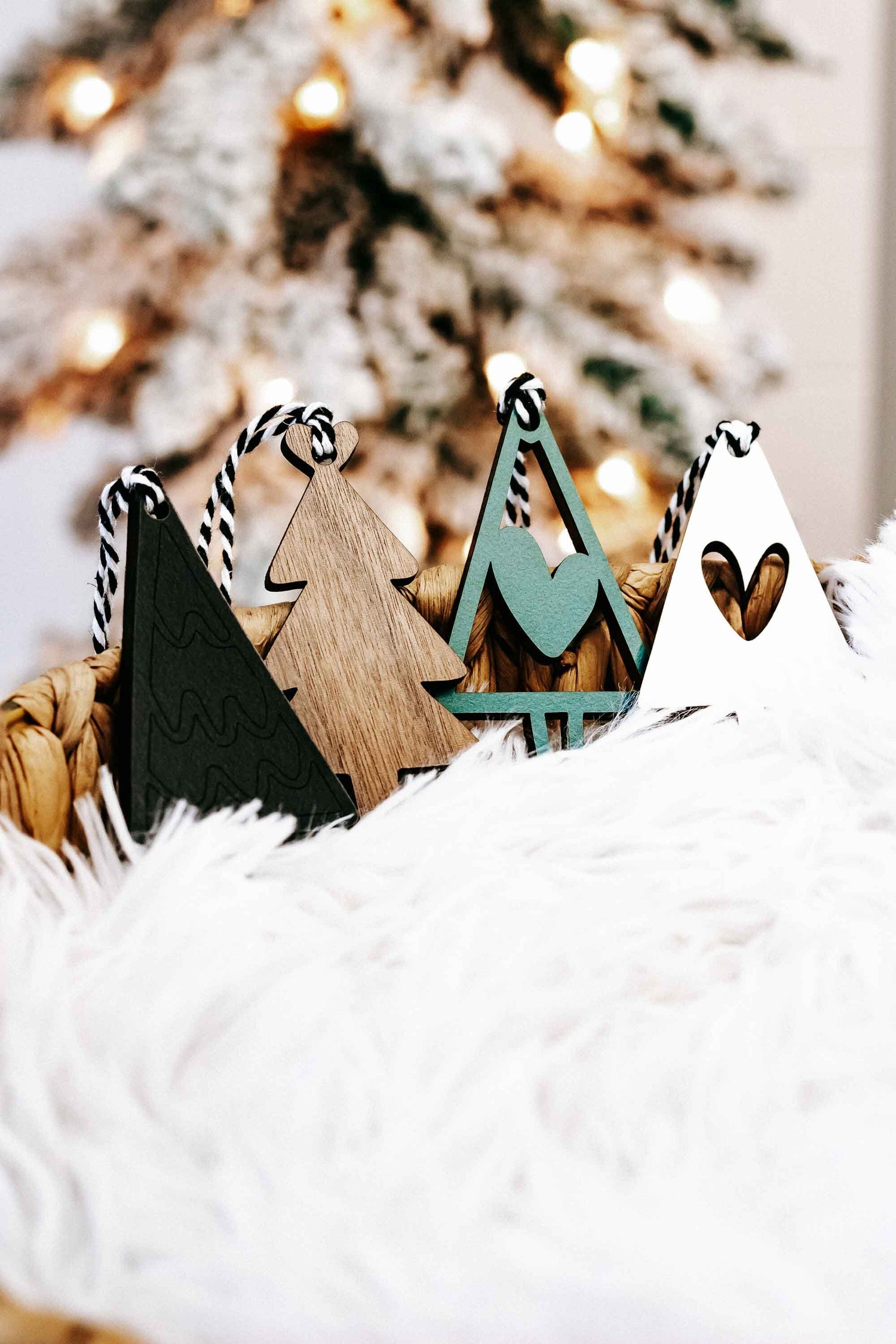 Mixed wooden Christmas tree ornaments, natural wood and dark green, with striped rope hangers