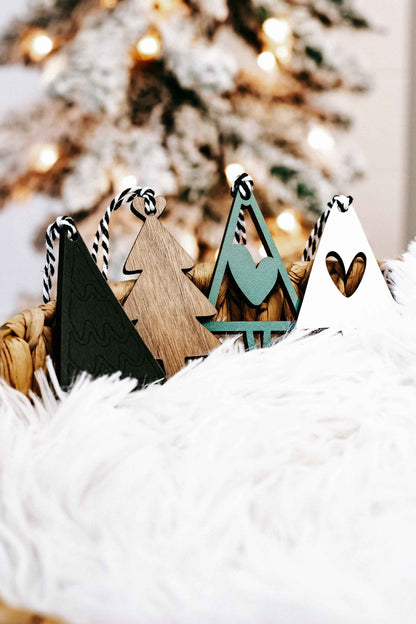 Mixed wooden Christmas tree ornaments, natural wood and dark green, with striped rope hangers