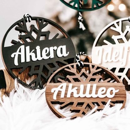 Personalized snowflake ornaments, dark and light round tags with white script names