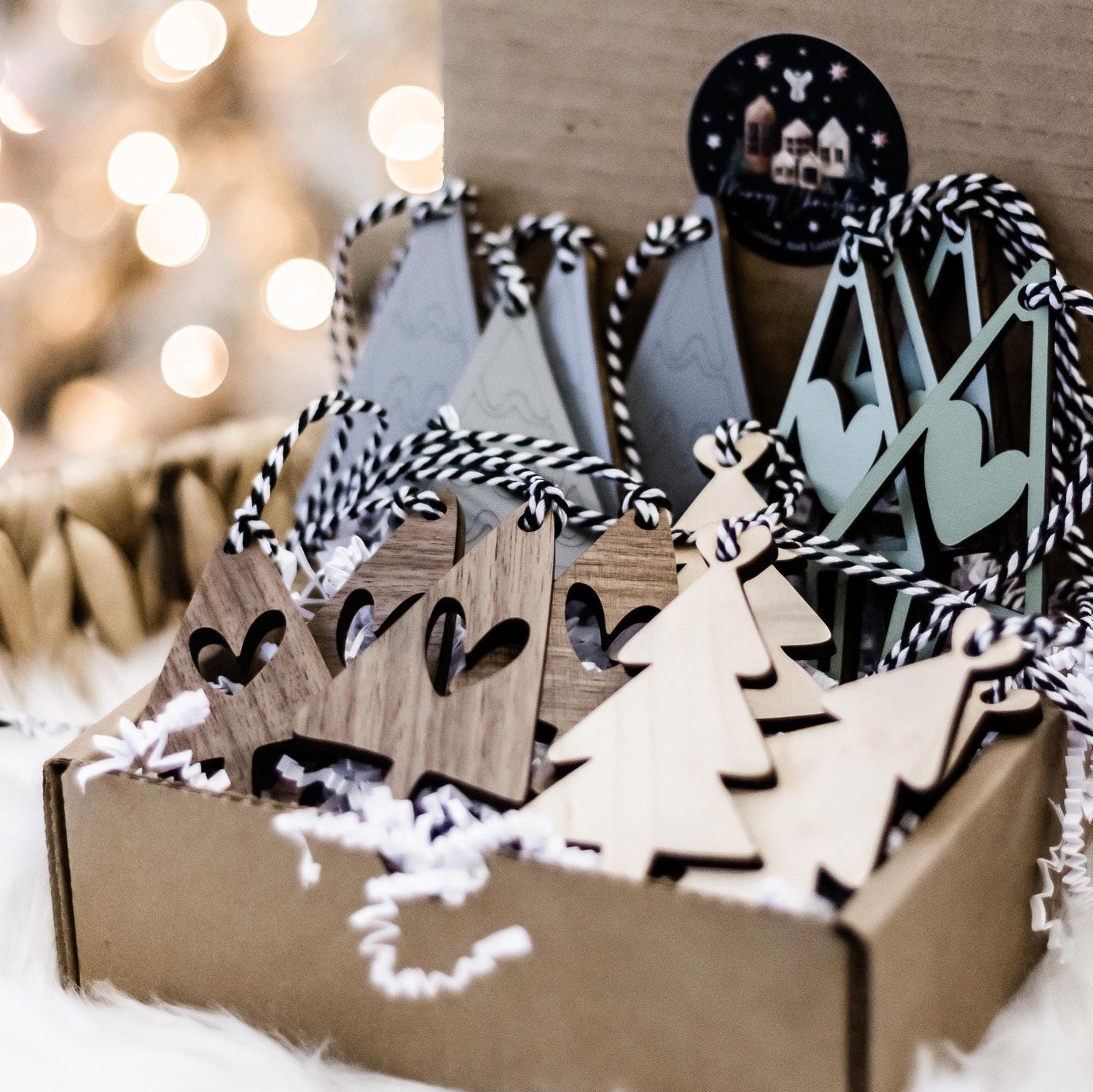 Set of 16 boho wood Christmas tree ornaments in gray and sage, with striped details