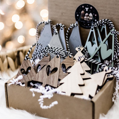 Set of 16 boho wood Christmas tree ornaments in gray and sage, with striped details
