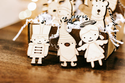 Set of 10 wooden character Christmas ornaments with rope hangers, nutcracker and angel figures