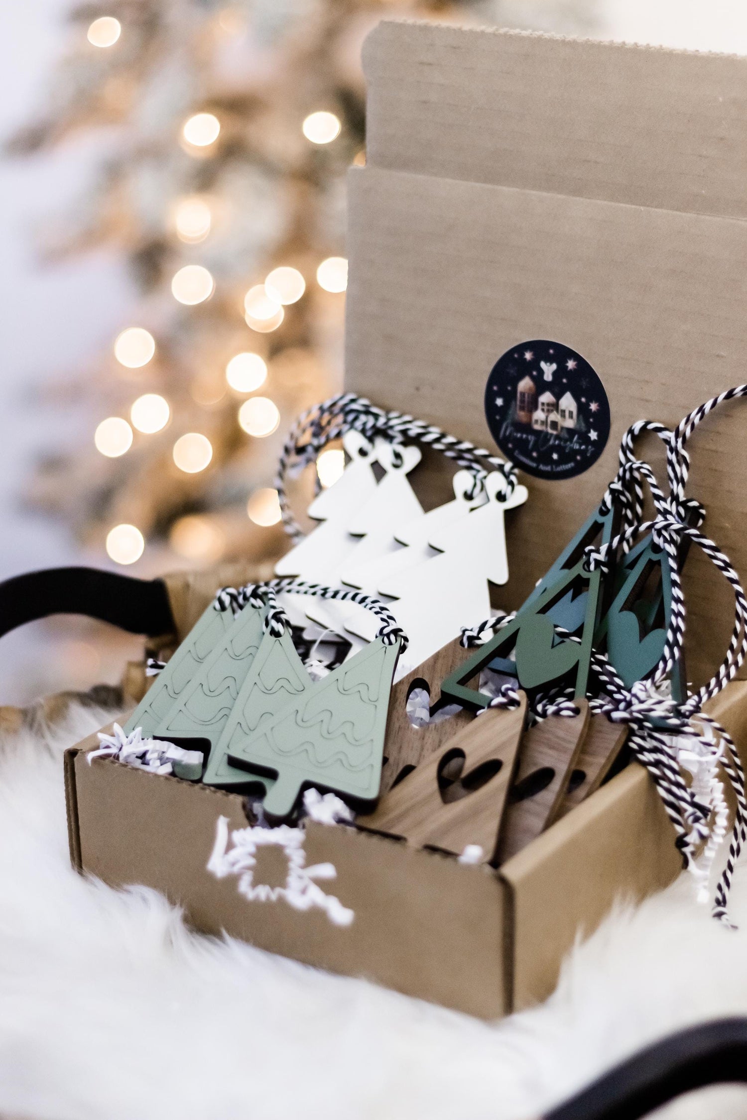 Wooden Christmas tree ornaments set in kraft box, white and green shapes with cords