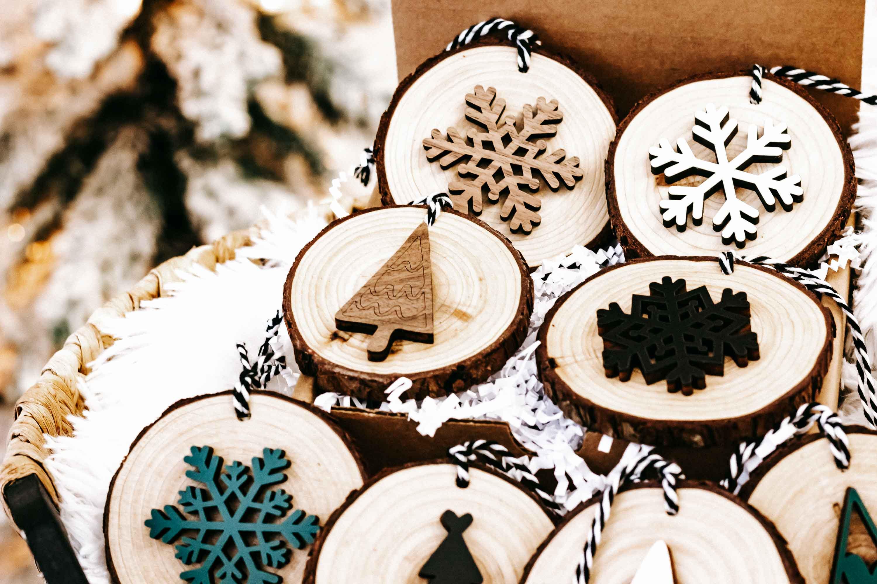 Set of wood slice Christmas ornaments with mixed snowflakes and tree motifs, string hangers