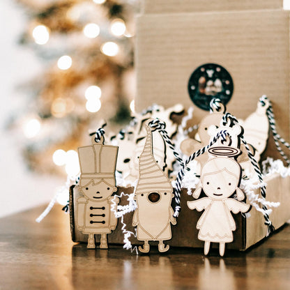Set of 10 wooden character Christmas ornaments with string hangers, nutcracker, angel and bear