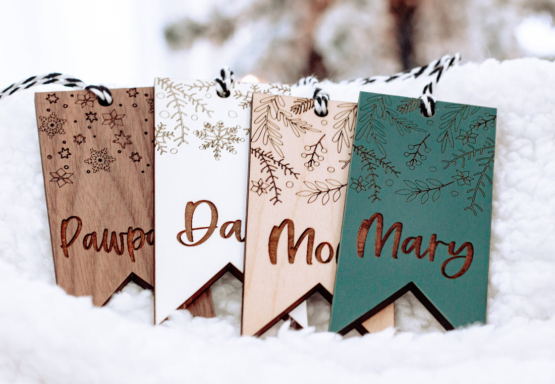 Boho floral stocking name tags set in wood tones, teal, and white with twig prints