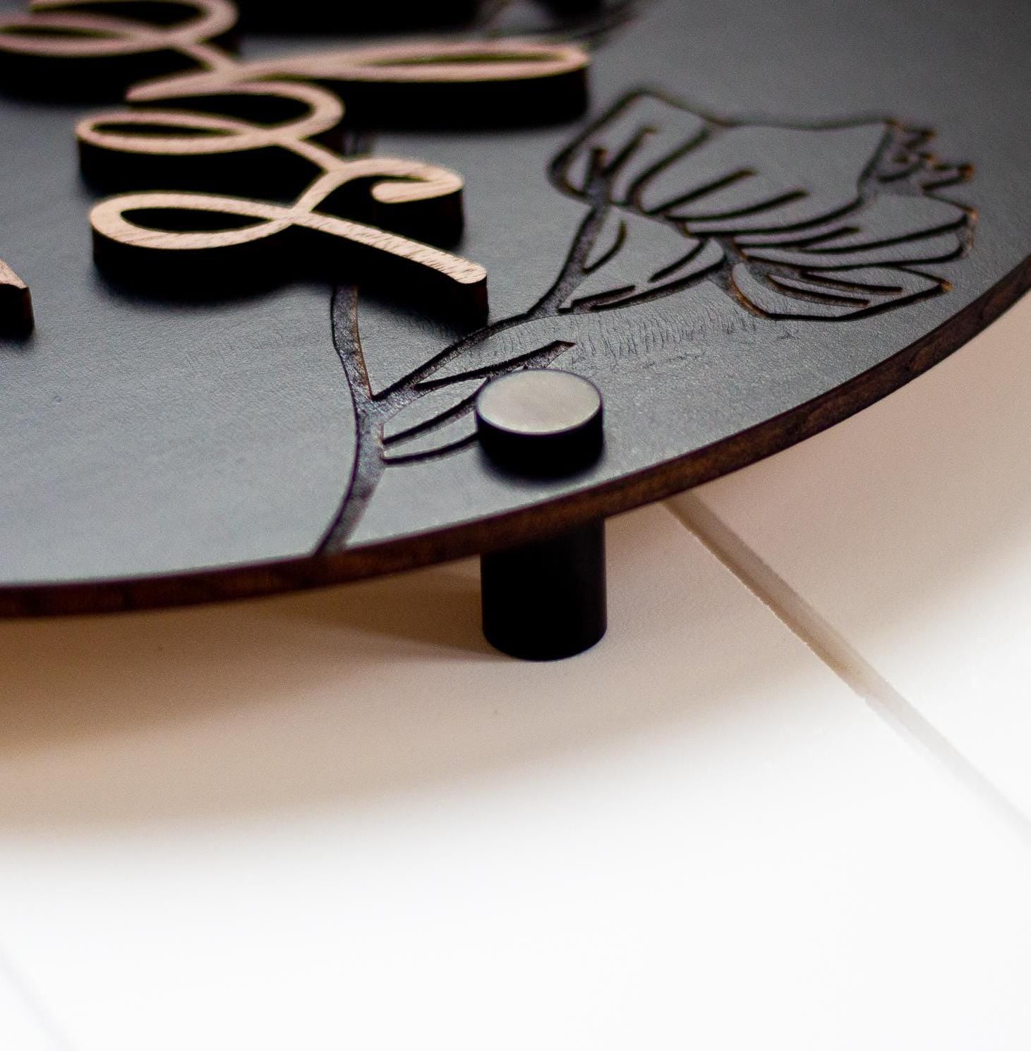 3D restroom changing room sign in dark finish, raised icons with small back stand feet