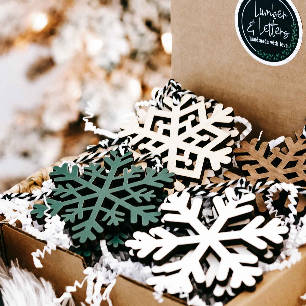 Set of minimalist snowflake wood Christmas tree ornaments in white and dark green