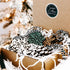 Set of 16 snowflake tree ornaments, white cutout wood with green and dark accents