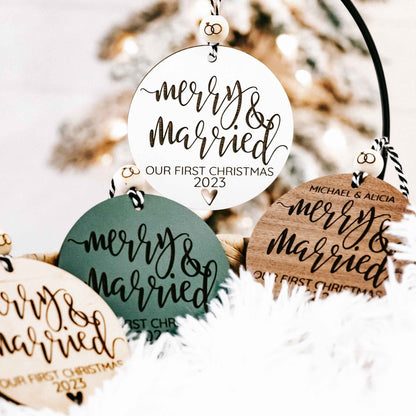 White round Christmas ornament with “Merry &amp; Married” and “Our First Christmas 2023”