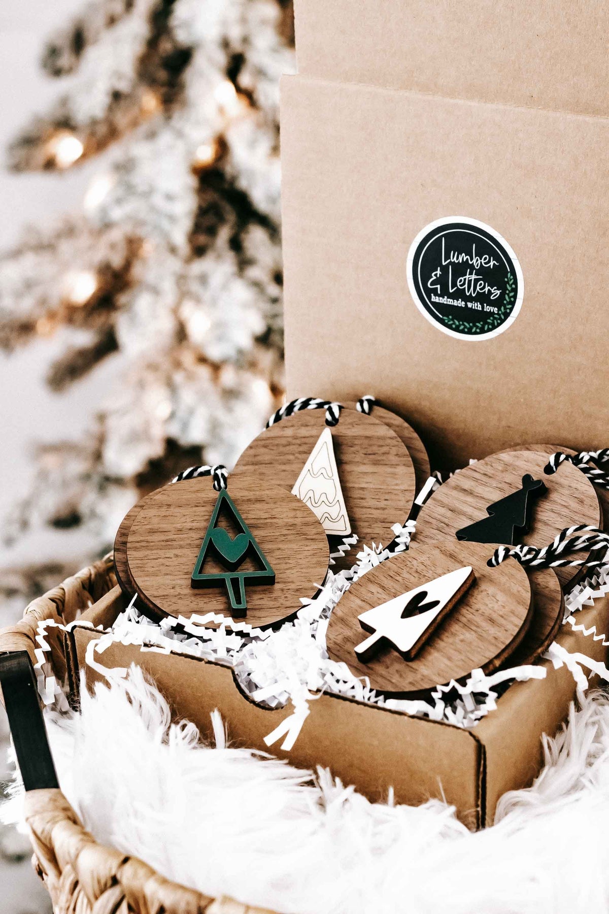 Wooden ornament set in kraft box with tree and heart shapes on striped string hangers