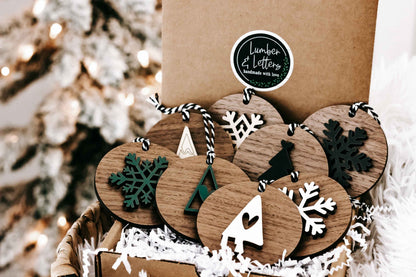 Set of 8 wooden Christmas ornaments in kraft box, featuring snowflakes, trees, and stars