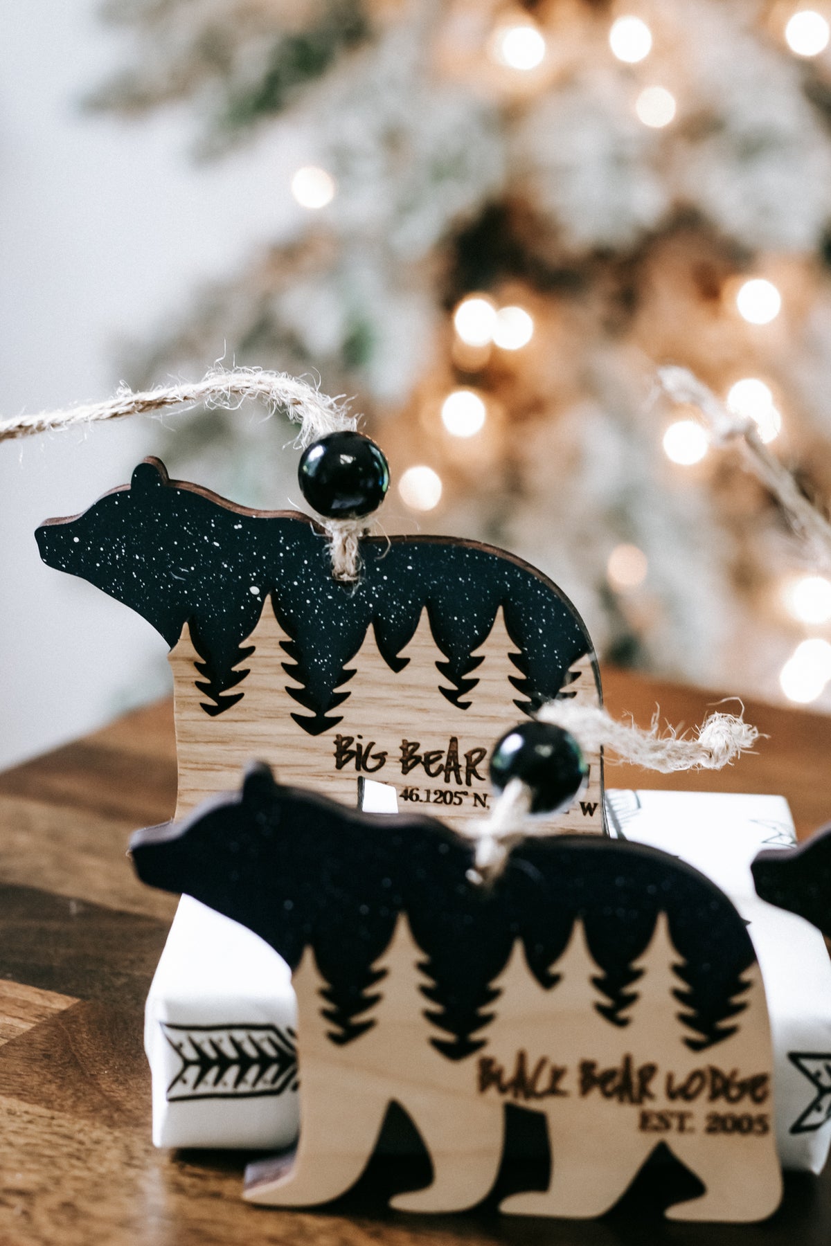 Bear cabin ornament with dark glitter body and dangling loop, engraved cabin lettering