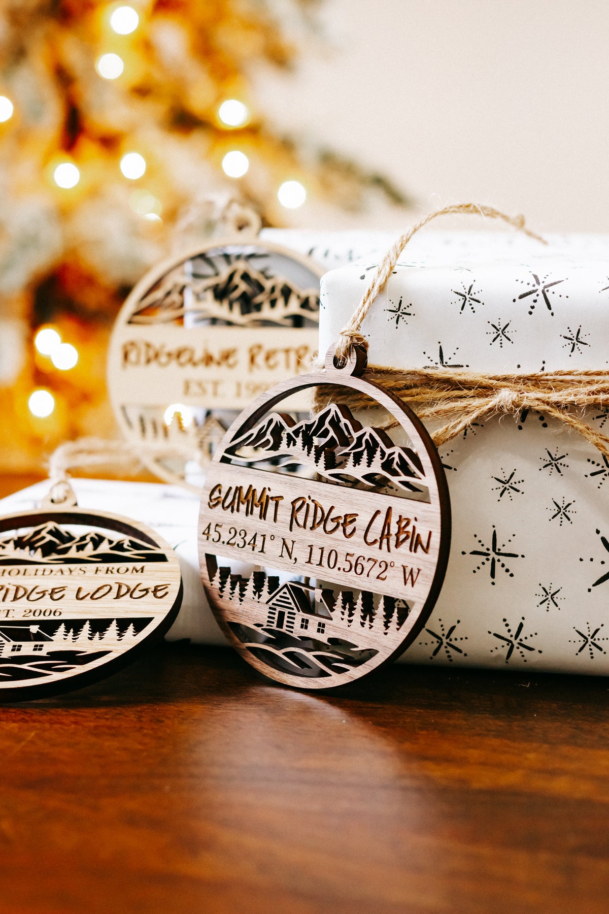 Round engraved wood cabin ornament with mountains and “Summit Ridge Cabin” lettering