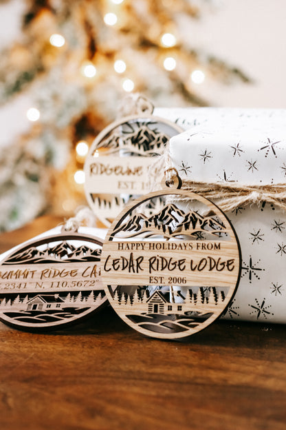 Round engraved wood ornament with “Happy Holidays from” and “Cedar Ridge Lodge”