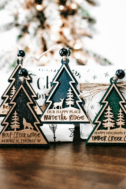 Hanging tree-shaped ornament set with dark, teal, and green color variations