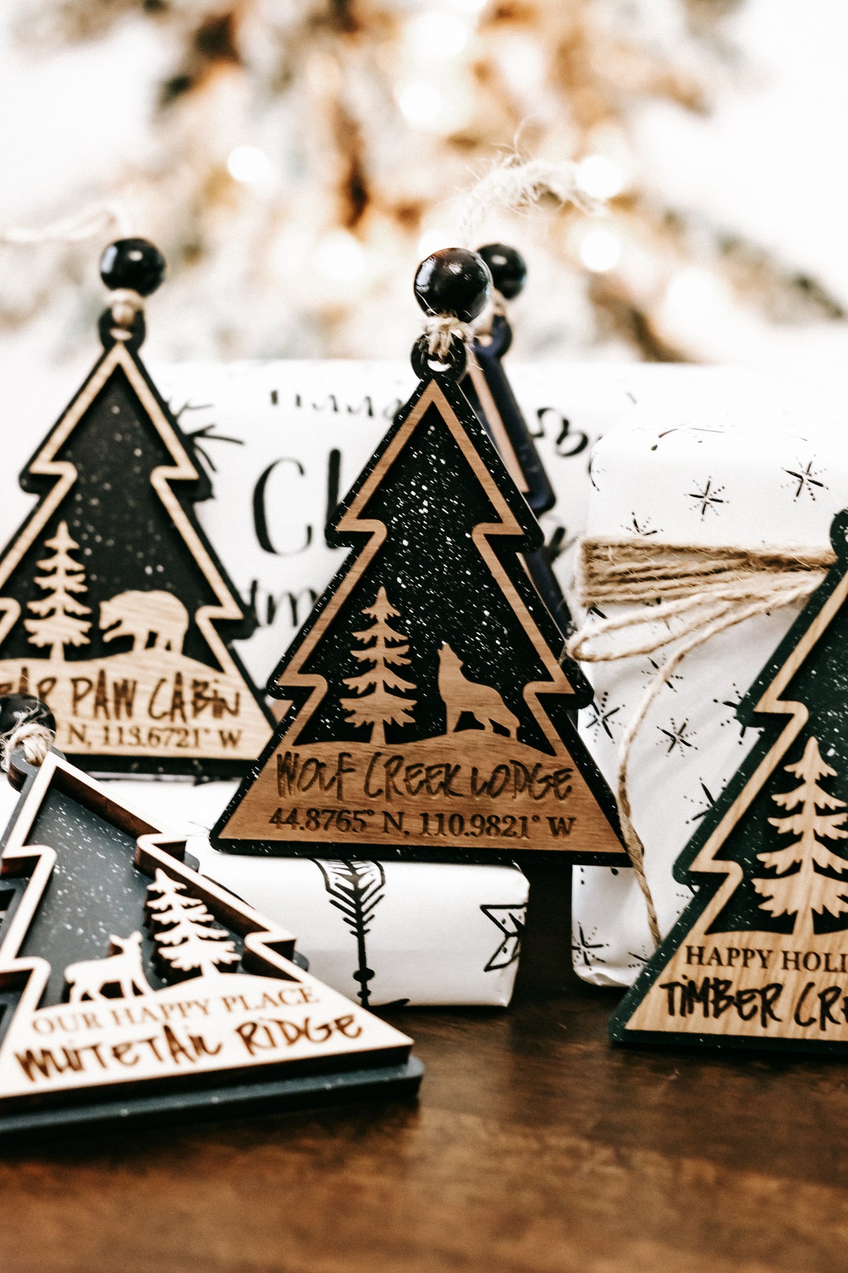 Set of hanging tree-shaped cabin lodge ornaments in dark green and teal