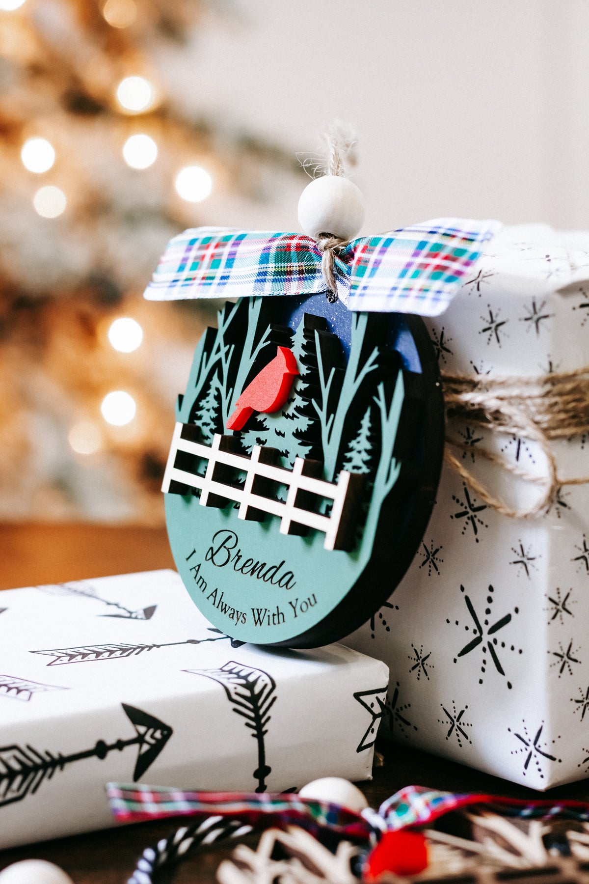 Personalized memorial ornament with red cardinals, tree scene, white fence, plaid bow