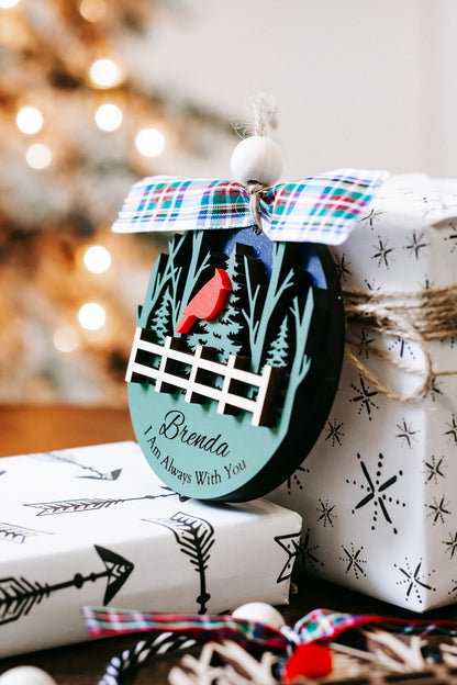 Personalized memorial ornament with red cardinals, tree scene, white fence, plaid bow