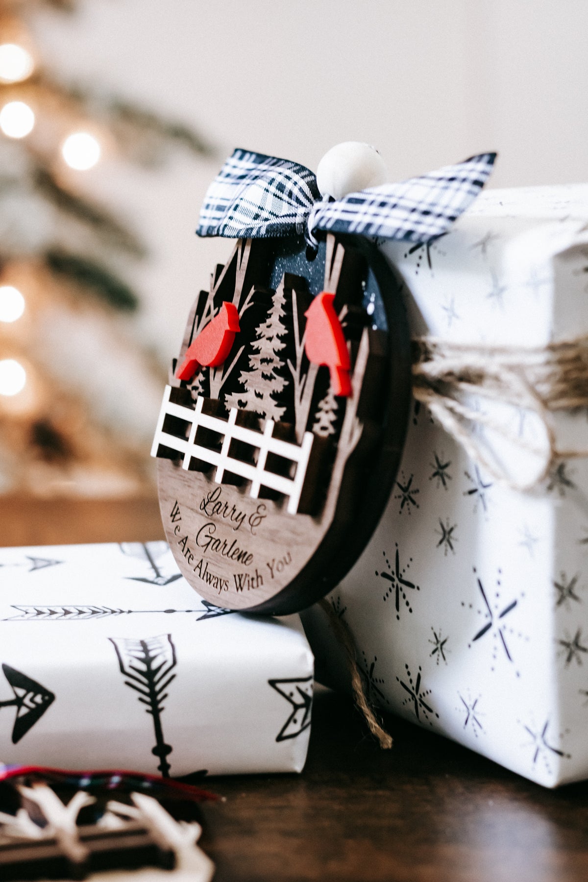 Personalized cardinal memorial ornament with plaid bow, red cardinals, white fence
