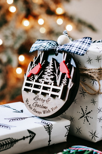 Cardinal memorial keepsake ornament with plaid bow, fence and trees; script message