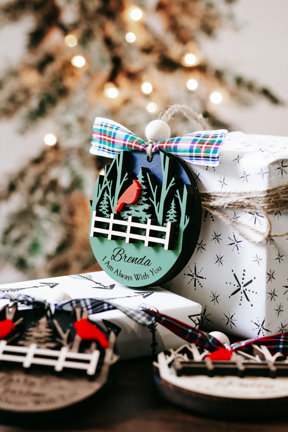 Cardinal memorial keepsake ornament with plaid bow, cardinal and fence; Brenda text