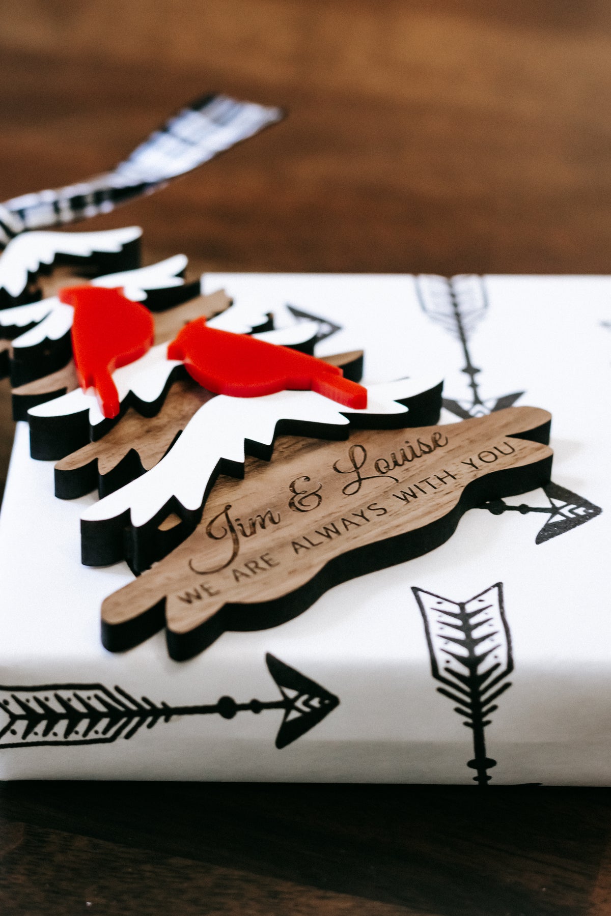 Layered evergreen memorial ornament with “We are always with you” and scripted names