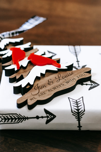 Layered evergreen memorial ornament with “We are always with you” and scripted names