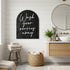 Arched black wall sign with gold and white &