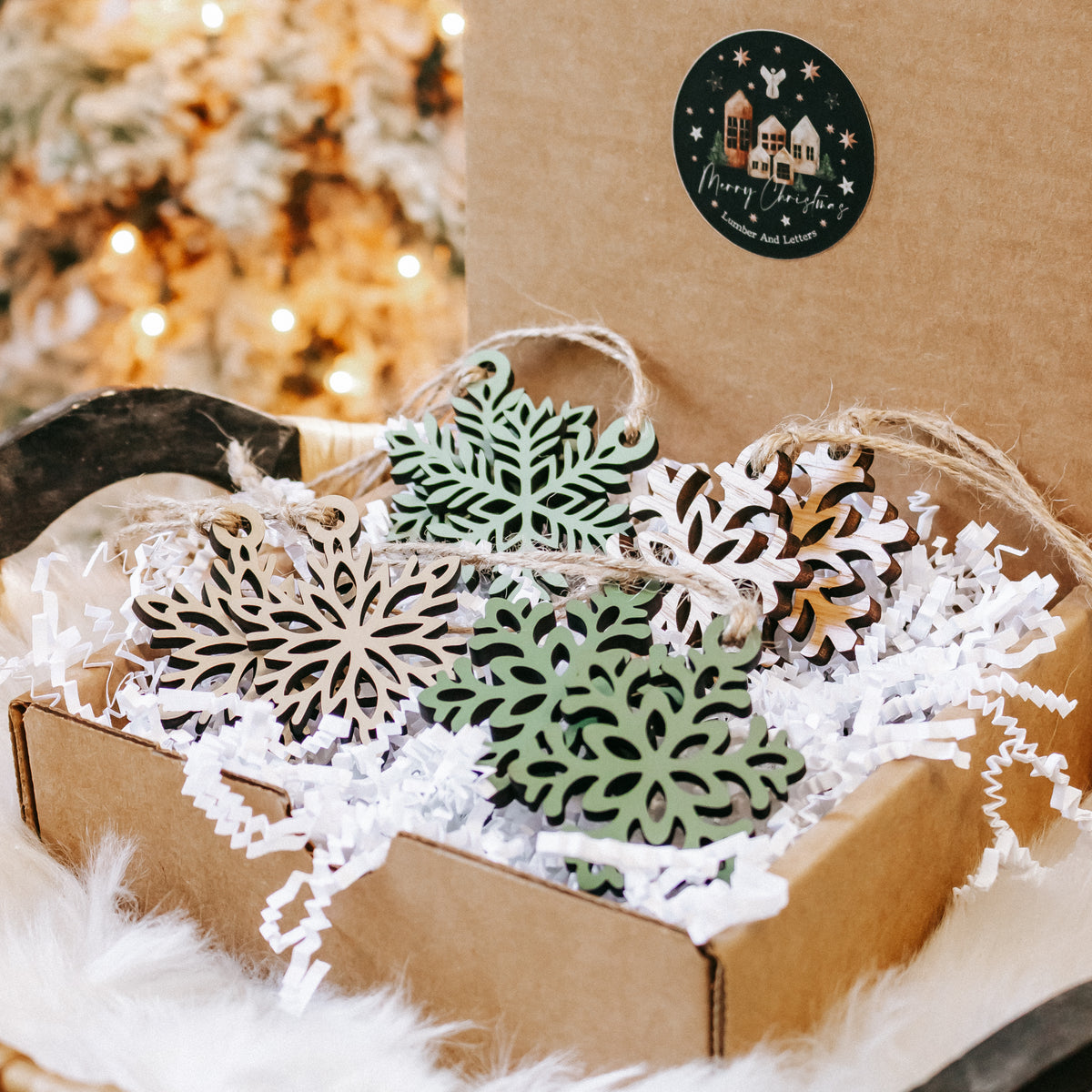 Mini wooden snowflake ornaments in a bundle, featuring green and natural wood designs