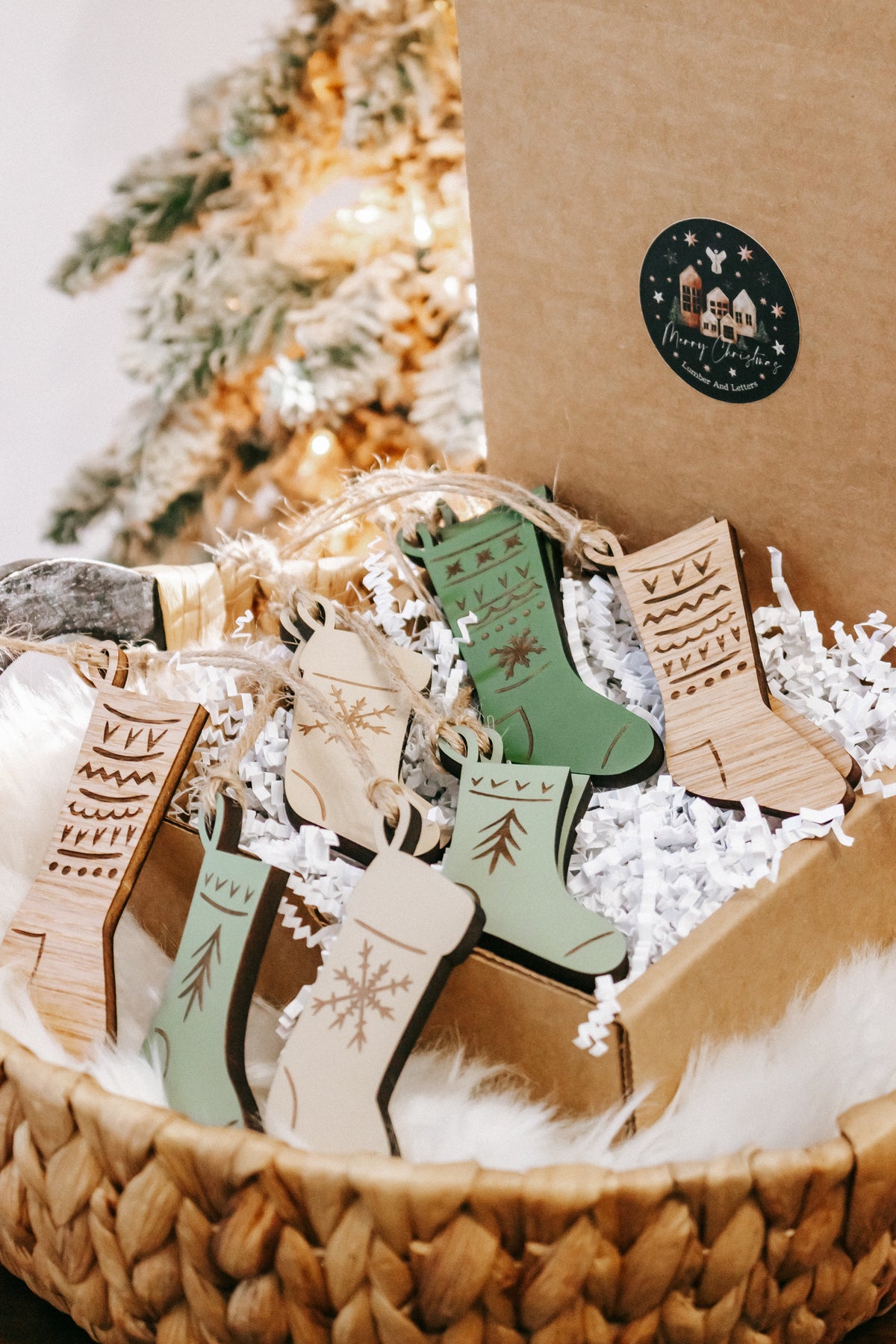 Engraved wooden stocking ornaments in kraft packaging with white filler and assorted colors